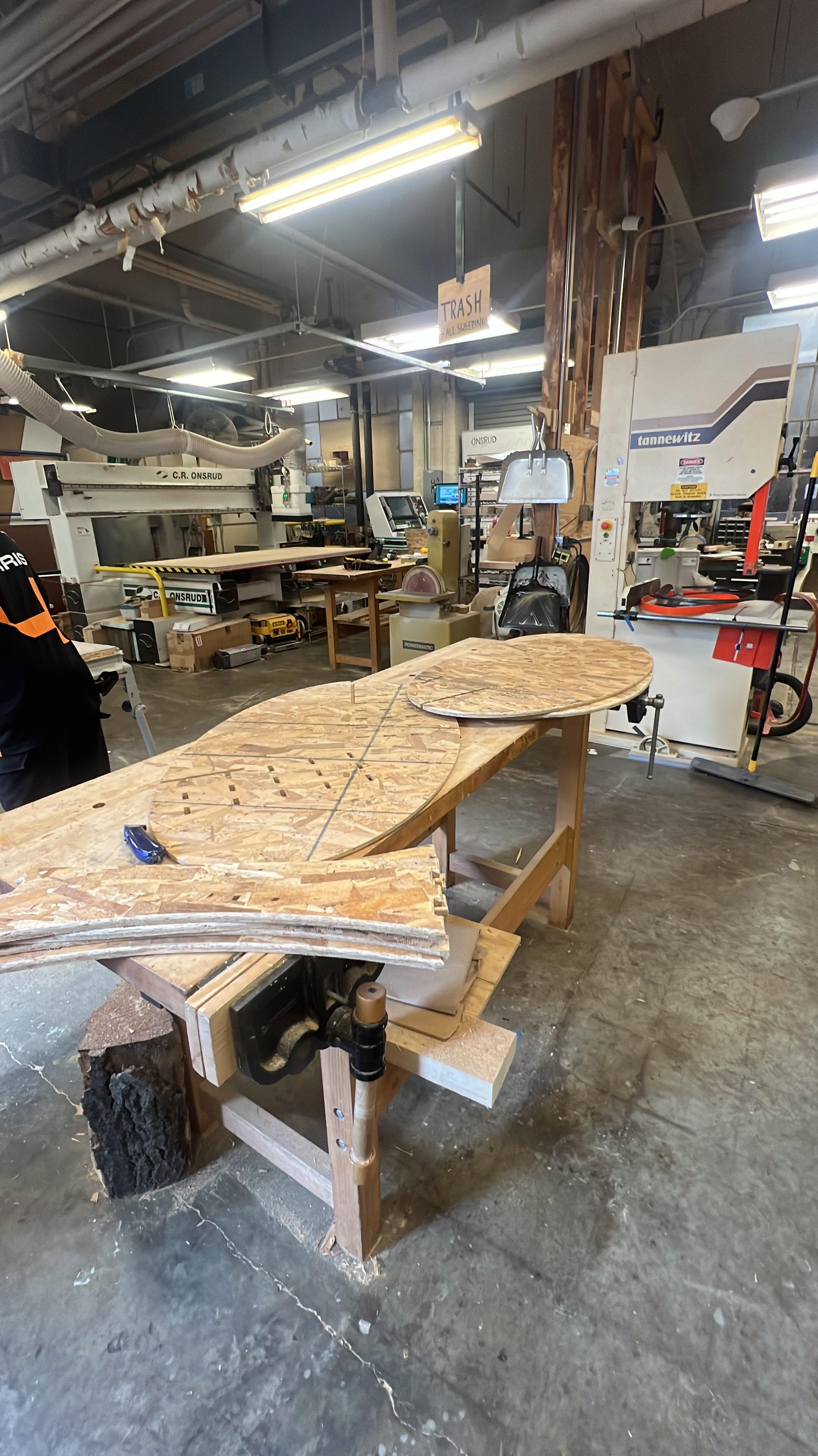 All milled plywood chair parts laid out on the table